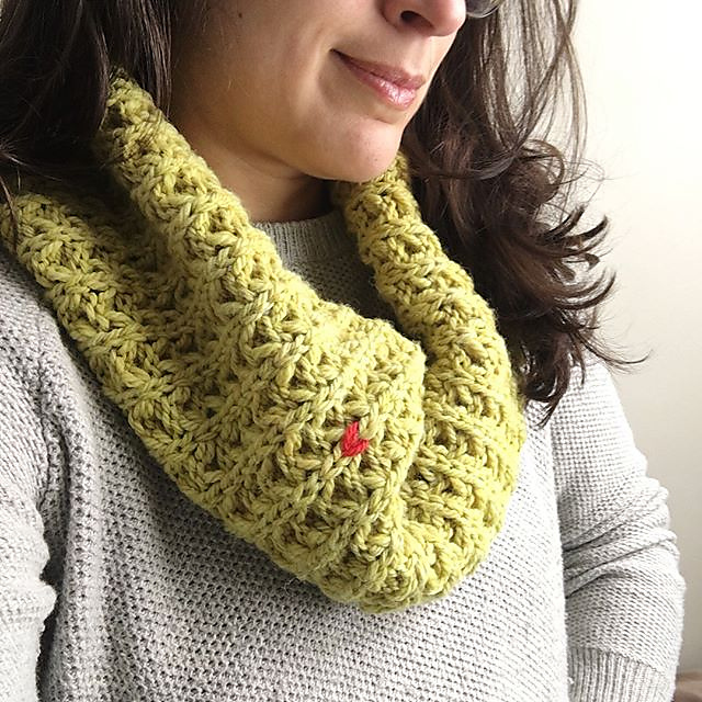 Margaux wearing a bright bulky chartreuse Penelope cowl with a contrasting Rare Stitch